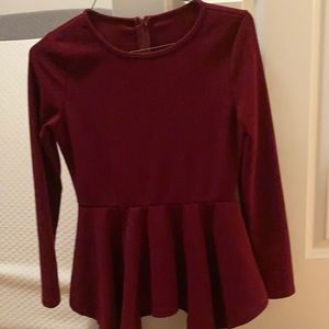 Burgundy peplum fish tail top. Back zipper-new w/out tag
